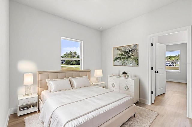14915 SW 39th Cir, Ocala, FL 34473 - bedroom featuring light wood-style floors and baseboards