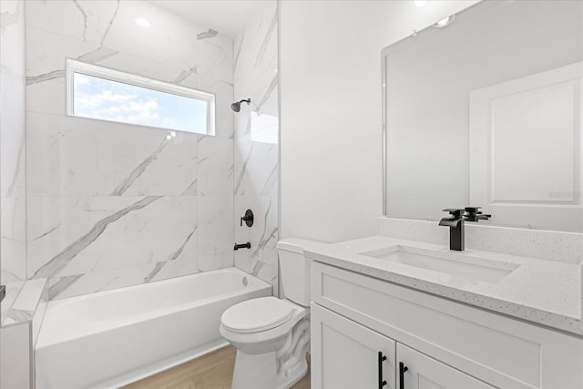 14915 SW 39th Cir, Ocala, FL 34473 - bathroom featuring vanity, toilet,  shower combination, and wood finished floors