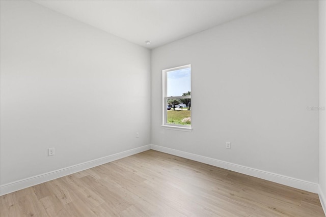 14915 SW 39th Cir, Ocala, FL 34473 - empty room featuring light wood-style floors and baseboards