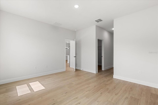 14915 SW 39th Cir, Ocala, FL 34473 - empty room with baseboards, light wood finished floors, and recessed lighting