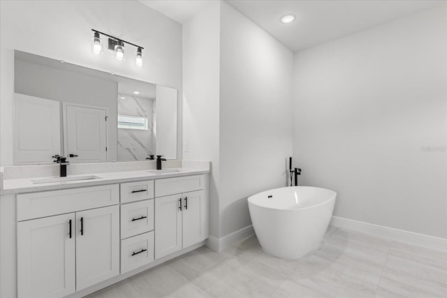 14915 SW 39th Cir, Ocala, FL 34473 - full bath featuring baseboards, double vanity, a freestanding tub, a marble finish shower, and recessed lighting