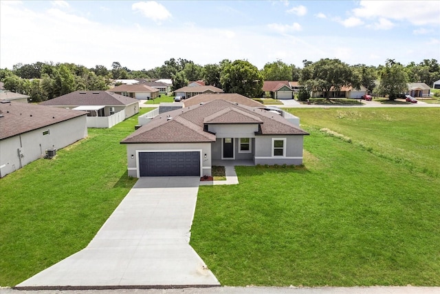 14915 SW 39th Cir, Ocala, FL 34473 - view of front of home featuring driveway, a garage, a front yard, and stucco siding