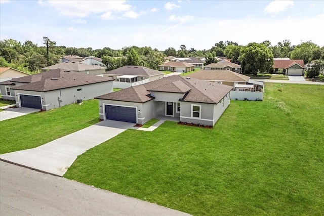 14915 SW 39th Cir, Ocala, FL 34473 - view of front of property with an attached garage, a front lawn, driveway, and a shingled roof