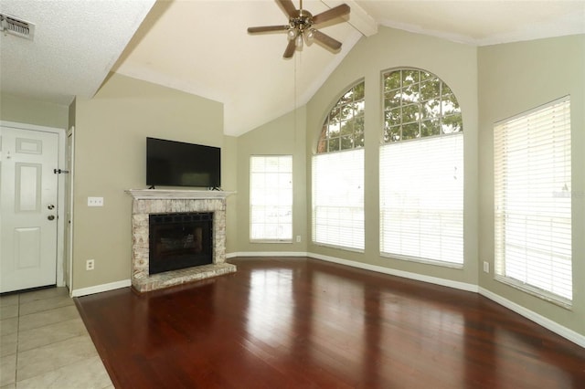620 Glenwood Ct Unit 79, Altamonte Springs, FL 32714 - unfurnished living room featuring healthy amount of natural light, a fireplace with raised hearth, and wood finished floors