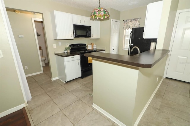 620 Glenwood Ct Unit 79, Altamonte Springs, FL 32714 - kitchen featuring black appliances, dark countertops, light tile patterned flooring, and white cabinetry