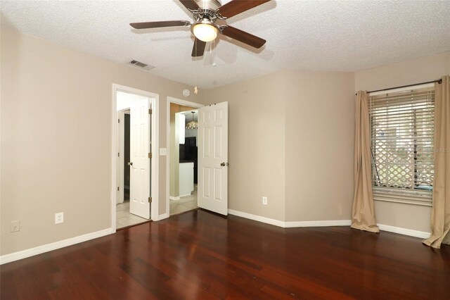 620 Glenwood Ct Unit 79, Altamonte Springs, FL 32714 - unfurnished bedroom with wood finished floors, a textured ceiling, baseboards, and a ceiling fan