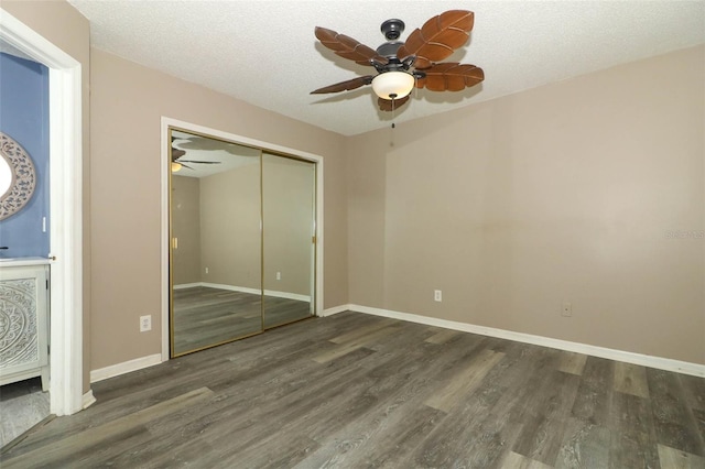 620 Glenwood Ct Unit 79, Altamonte Springs, FL 32714 - unfurnished bedroom with wood finished floors, baseboards, a closet, a ceiling fan, and a textured ceiling