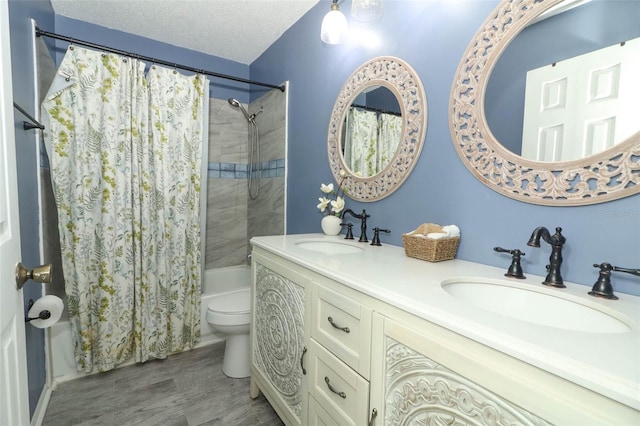 620 Glenwood Ct Unit 79, Altamonte Springs, FL 32714 - bathroom featuring shower / tub combo, toilet, double vanity, wood finished floors, and a textured ceiling