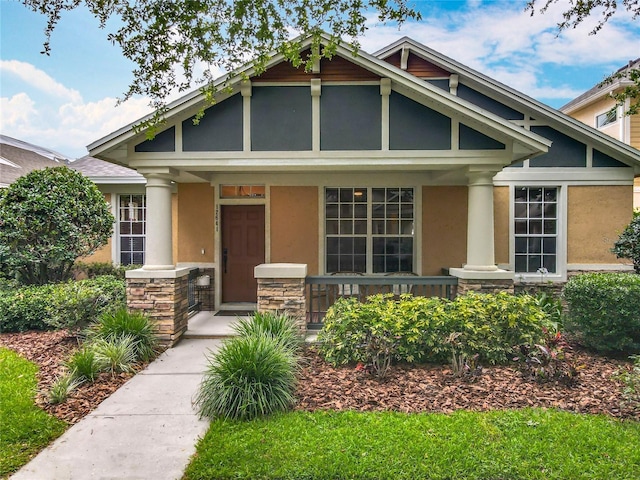 12641 Arley Dr, Windermere, FL 34786 - craftsman inspired home featuring covered porch, stone siding, and stucco siding