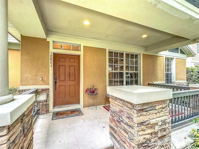 12641 Arley Dr, Windermere, FL 34786 - property entrance featuring stucco siding and a porch