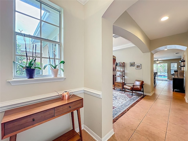 12641 Arley Dr, Windermere, FL 34786 - corridor featuring arched walkways, light tile patterned floors, baseboards, recessed lighting, and ornamental molding