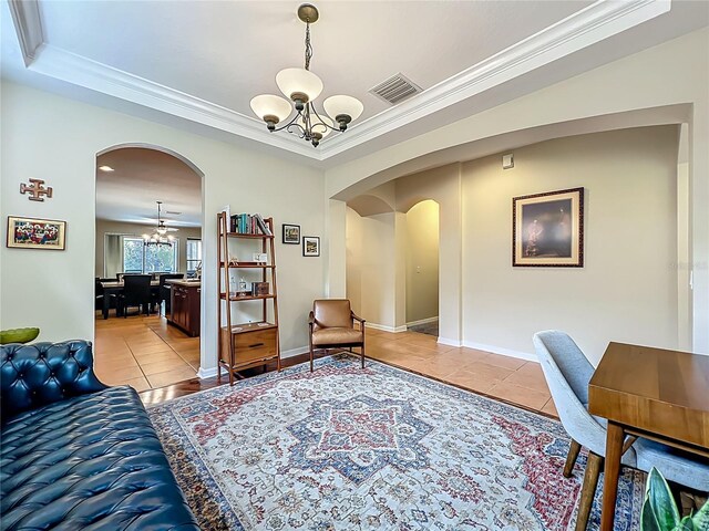12641 Arley Dr, Windermere, FL 34786 - home office featuring arched walkways, a chandelier, light tile patterned flooring, ornamental molding, and a tray ceiling