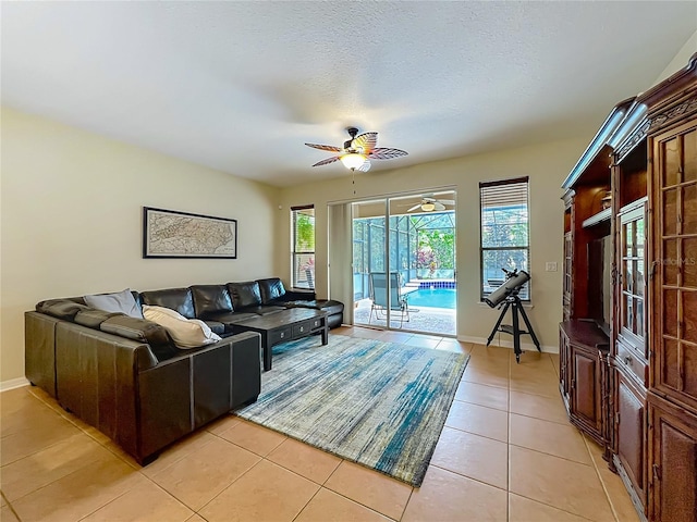 12641 Arley Dr, Windermere, FL 34786 - living area featuring ceiling fan, light tile patterned floors, and baseboards