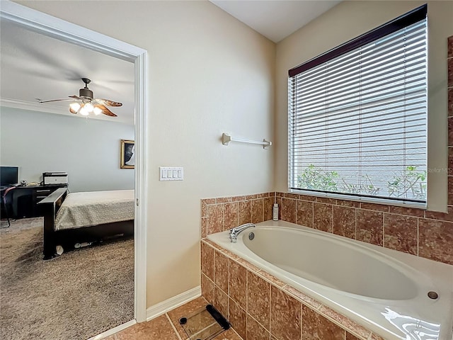 12641 Arley Dr, Windermere, FL 34786 - bathroom featuring connected bathroom, a bath, ceiling fan, tile patterned flooring, and baseboards