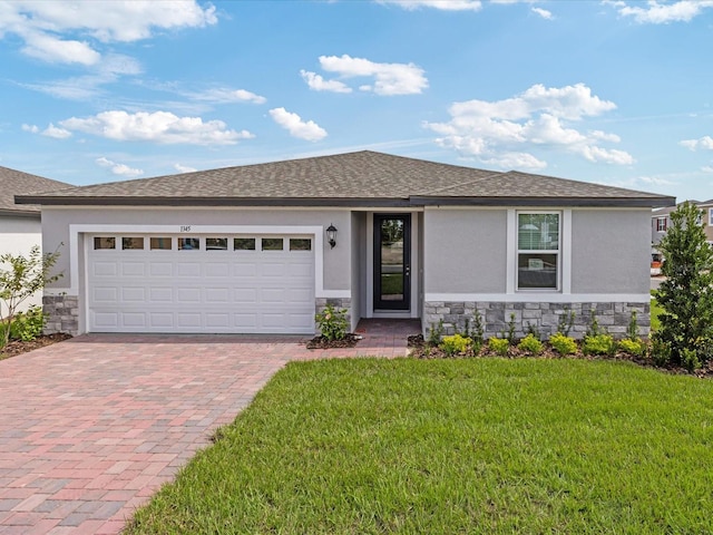 1345 Griffon Ave, Lake Alfred, FL 33850 - view of front of house featuring stone siding, stucco siding, and decorative driveway