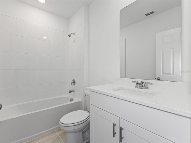 1345 Griffon Ave, Lake Alfred, FL 33850 - bathroom featuring toilet, vanity,  shower combination, and tile patterned flooring