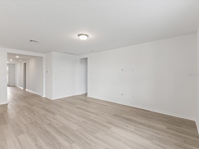 1345 Griffon Ave, Lake Alfred, FL 33850 - unfurnished room with light wood finished floors and baseboards