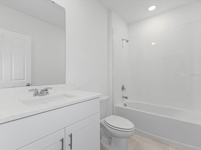 1345 Griffon Ave, Lake Alfred, FL 33850 - full bath featuring toilet, vanity, bathing tub / shower combination, tile patterned floors, and recessed lighting
