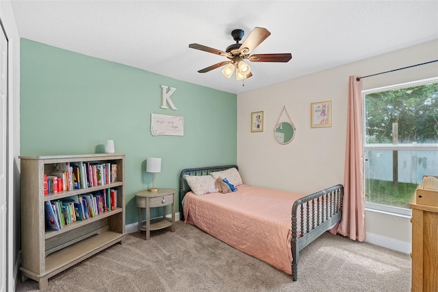 2913 Wilshire Rd, Clermont, FL 34714 - carpeted bedroom featuring multiple windows and a ceiling fan