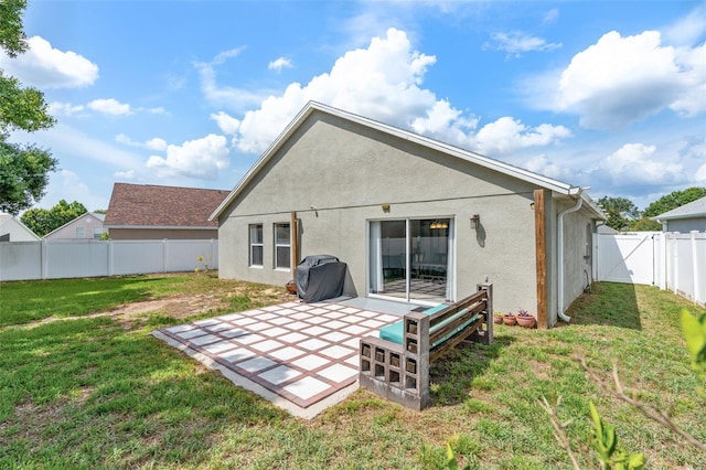 2913 Wilshire Rd, Clermont, FL 34714 - back of property featuring a patio, a fenced backyard, and stucco siding