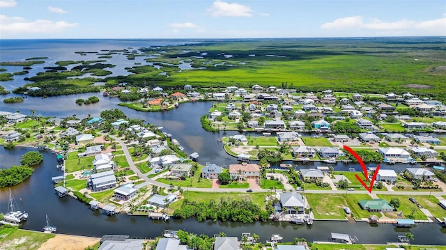24277 Treasure Island Blvd, Punta Gorda, FL 33955 - aerial overview of property's location featuring a large body of water and nearby suburban area