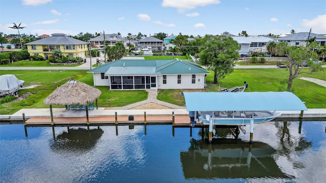 24277 Treasure Island Blvd, Punta Gorda, FL 33955 - dock area featuring boat lift, a residential view, a gazebo, and a water view