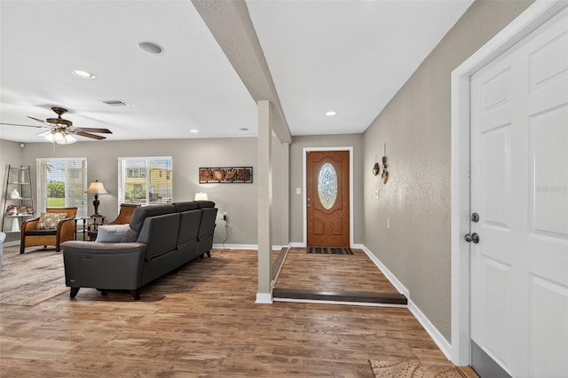 24277 Treasure Island Blvd, Punta Gorda, FL 33955 - entryway featuring wood finished floors, a ceiling fan, recessed lighting, and a textured wall