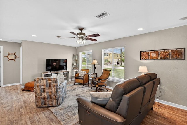 24277 Treasure Island Blvd, Punta Gorda, FL 33955 - living area with wood finished floors, ceiling fan, and recessed lighting