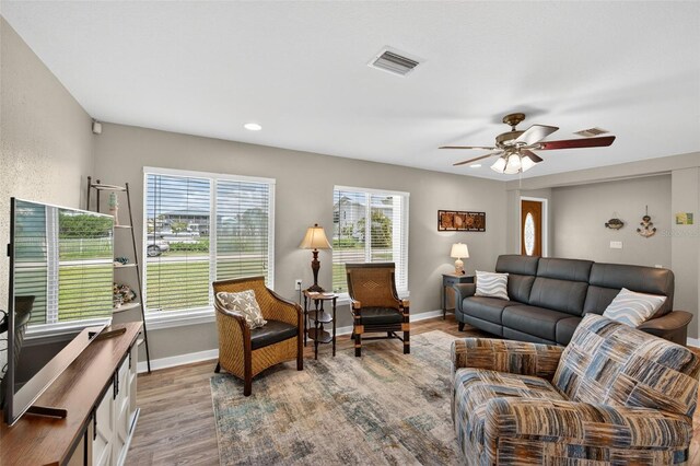 24277 Treasure Island Blvd, Punta Gorda, FL 33955 - living area featuring wood finished floors, plenty of natural light, a ceiling fan, and recessed lighting