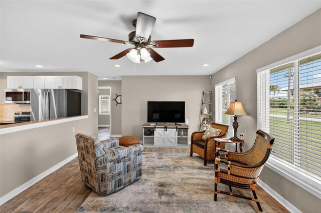 24277 Treasure Island Blvd, Punta Gorda, FL 33955 - living area with plenty of natural light, wood finished floors, ceiling fan, and recessed lighting