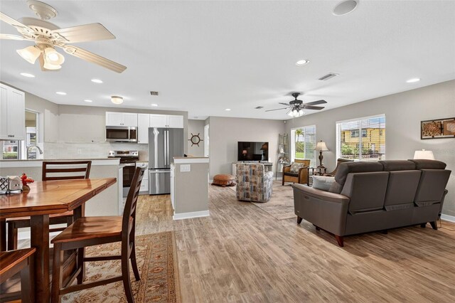 24277 Treasure Island Blvd, Punta Gorda, FL 33955 - living area featuring a ceiling fan, light wood-type flooring, and recessed lighting