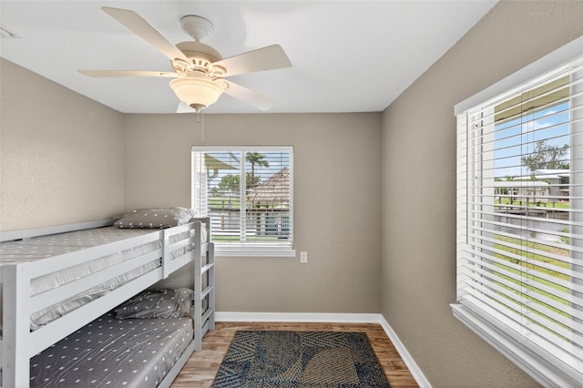 24277 Treasure Island Blvd, Punta Gorda, FL 33955 - bedroom with light wood finished floors and a ceiling fan