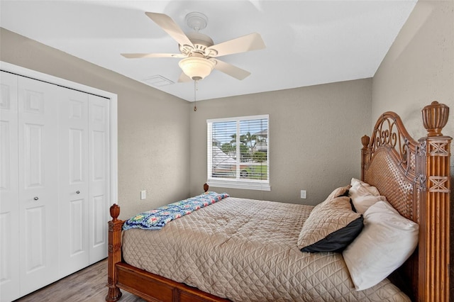 24277 Treasure Island Blvd, Punta Gorda, FL 33955 - bedroom with a closet, wood finished floors, and ceiling fan
