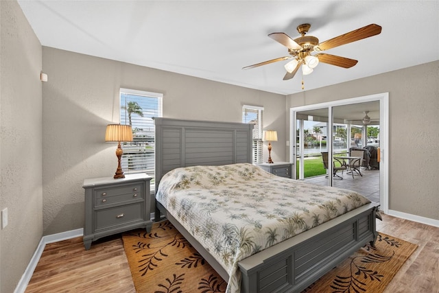 24277 Treasure Island Blvd, Punta Gorda, FL 33955 - bedroom with access to exterior, light wood-type flooring, ceiling fan, and a textured wall