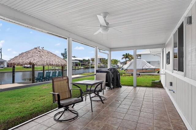 24277 Treasure Island Blvd, Punta Gorda, FL 33955 - sunroom with ceiling fan, a water view, and plenty of natural light