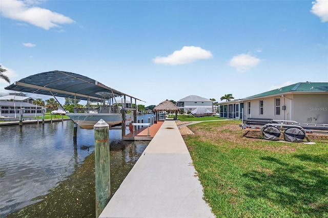 24277 Treasure Island Blvd, Punta Gorda, FL 33955 - dock with boat lift, a yard, and a water view