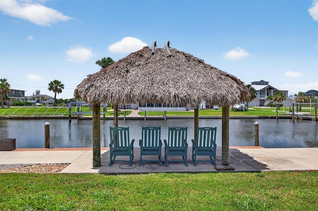 24277 Treasure Island Blvd, Punta Gorda, FL 33955 - dock with a water view, a residential view, a gazebo, and a lawn