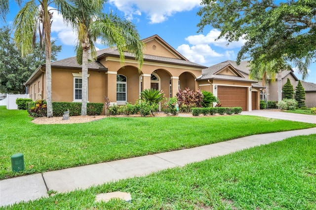 2313 Pesaro Cir, Ocoee, FL 34761 - view of front of house featuring stucco siding, an attached garage, and driveway