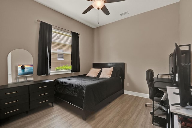 2313 Pesaro Cir, Ocoee, FL 34761 - bedroom featuring light wood finished floors, baseboards, and ceiling fan