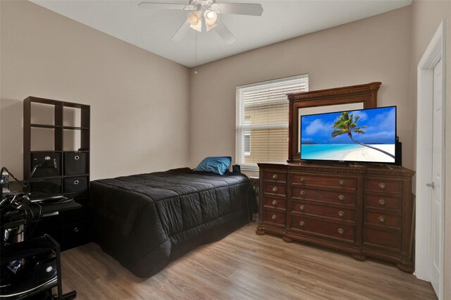 2313 Pesaro Cir, Ocoee, FL 34761 - bedroom featuring light wood finished floors, a desk, and a ceiling fan