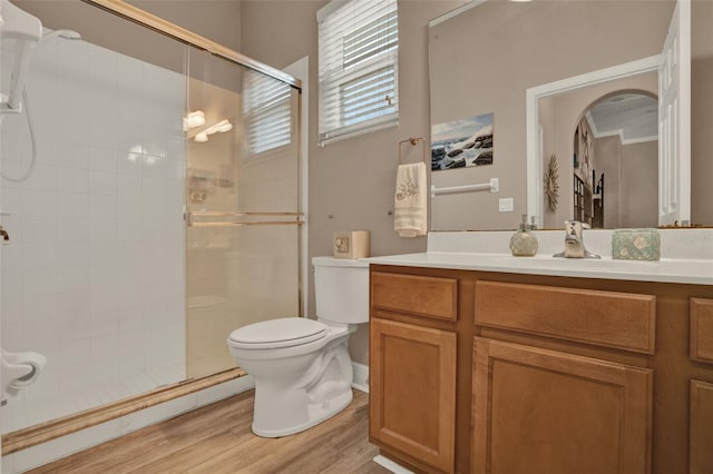 2313 Pesaro Cir, Ocoee, FL 34761 - bathroom featuring toilet, a shower stall, vanity, and wood finished floors