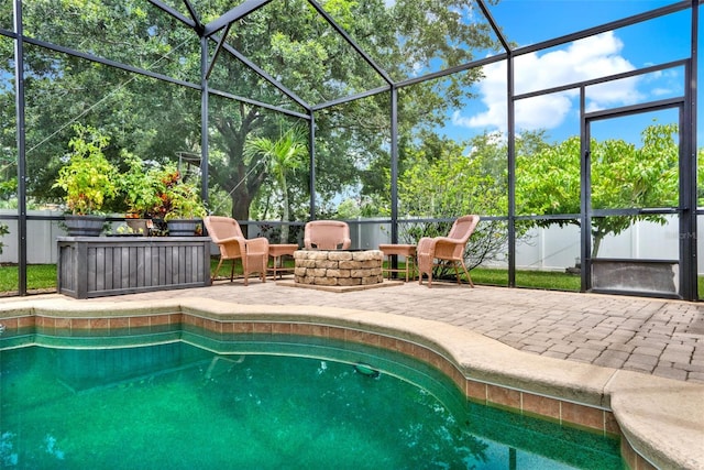 2313 Pesaro Cir, Ocoee, FL 34761 - view of pool featuring a patio area, glass enclosure, and an outdoor fire pit