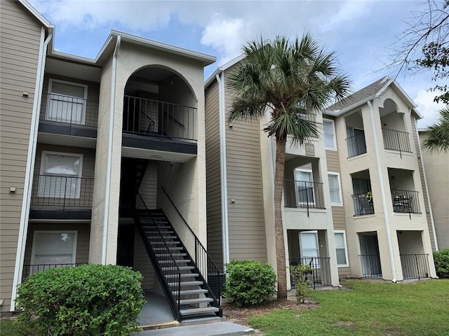 4756 Walden Cir Unit 21, Orlando, FL 32811 - view of apartment building / complex featuring stairway