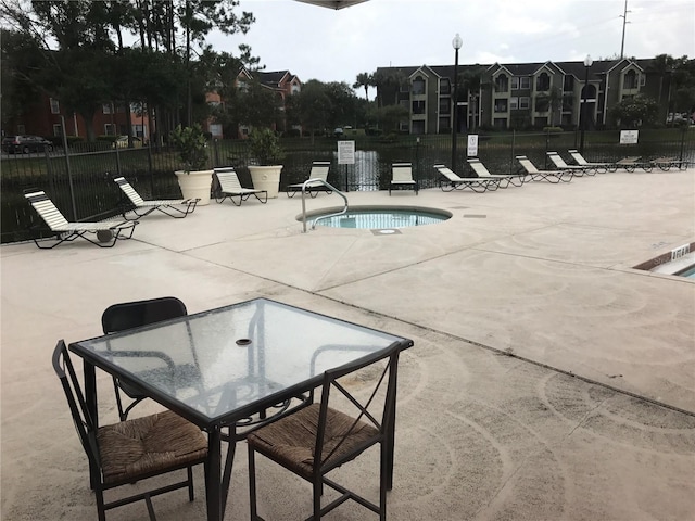 4756 Walden Cir Unit 21, Orlando, FL 32811 - community pool with a patio area and outdoor dining area