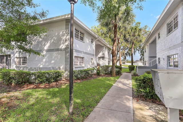 563 Midway Trak Unit K102, Ocala, FL 34472 - view of community featuring a yard