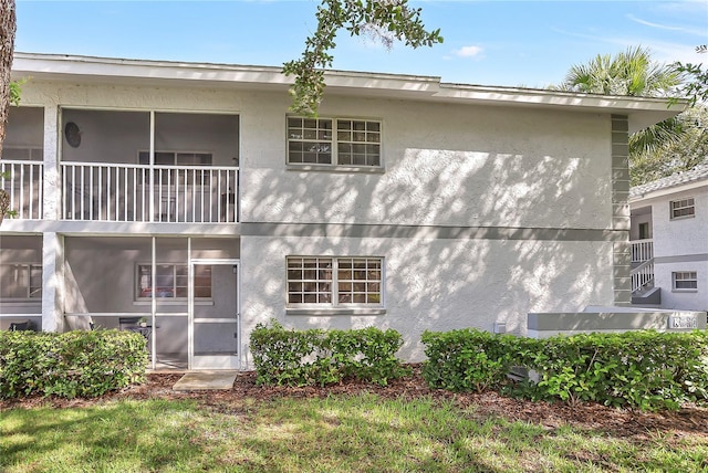 563 Midway Trak Unit K102, Ocala, FL 34472 - back of house with stucco siding