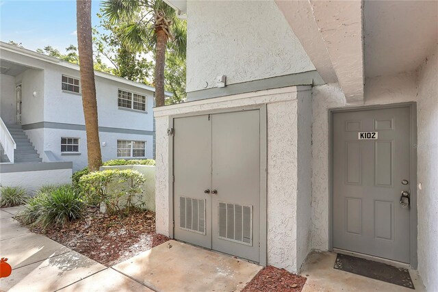 563 Midway Trak Unit K102, Ocala, FL 34472 - entrance to property with stucco siding
