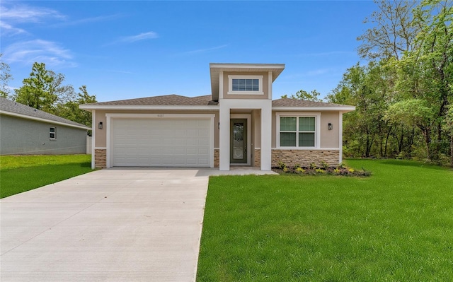 16357 SE 88th Ct, Summerfield, FL 34491 - prairie-style house with stone siding, an attached garage, concrete driveway, and a front lawn