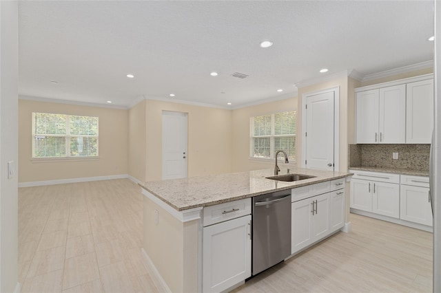 16357 SE 88th Ct, Summerfield, FL 34491 - kitchen featuring a sink, dishwasher, plenty of natural light, a center island with sink, and ornamental molding