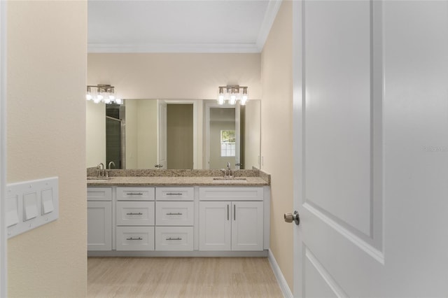 16357 SE 88th Ct, Summerfield, FL 34491 - full bathroom with crown molding, double vanity, a shower with door, and baseboards